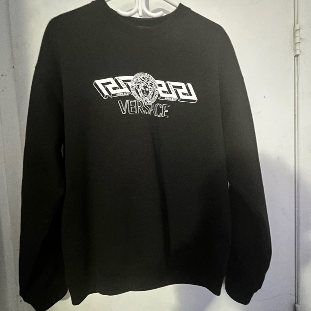 A black medusa Versace sweater